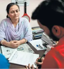  ??  ?? A STUDENT FILLS UP an admission form at a tuition centre for job exams in New Delhi.