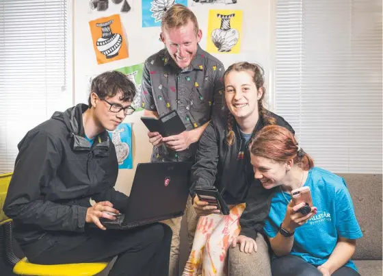  ?? Picture: Kevin Farmer ?? SWIPING RIGHT: Taking part in a research experiment to determine the best online dating websites for people living with disabiliti­es are (from left) Jared Jones, Scott Tiran, Caitlin Mortlock and Ella McGuire.
