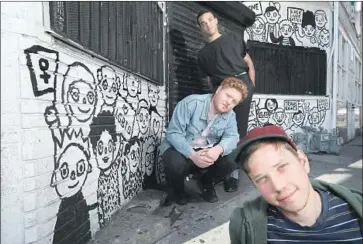  ?? Mel Melcon Los Angeles Times ?? BAND members Pascal Stevenson, from top, Andrew MacKelvie and Sean Solomon at Solomon’s Smell mural.