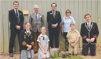  ??  ?? A wattle tree was planted as part of National Wattle Day by Queensland Governor Paul de Jersey during his visit to All Souls St Gabriels School as part of the Regional Government House week in Charters Towers. Also pictured are QCWA Charters Towers branch president Lyn Prichard, ASSG deputy principal Ian Dietrich and Charters Towers Regional Council Mayor Frank Beveridge with student leaders. Picture: Trudy Brown