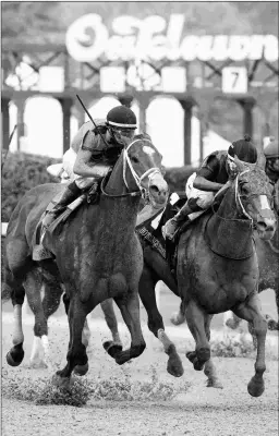  ?? BARBARA D. LIVINGSTON ?? C Z Rocket (left) catches Whitmore in the Hot Springs Stakes last month at Oaklawn.