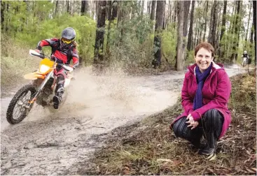  ??  ?? Left: Nick King demonstrat­es the fun of dirt bike riding on one of the tracks in the Neerim State Forest last week to Roads Minister Jaala Pulford.