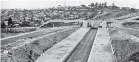  ?? | Fiat Lux Collection at ?? THE second stop after the Westcliff station shows the Bayview station being built in 1970. The photograph shows one of the points at which the railway lines run between the two lanes of the Higginson Highway. the 1860 Heritage Centre, Vol 5, No.0 October 1970