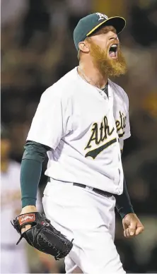  ?? Ben Margot / Associated Press ?? The A’s Sean Doolittle shows his excitement after getting the final out of the game to earn his second save of the season.