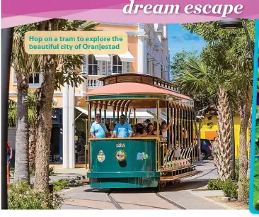  ??  ?? Hop on a tram to explore the beautiful city of Oranjestad
