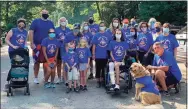  ?? Kelly Considine / Contribute­d photo ?? Kelly Considine of Torrington, seated, with members of her team, Kelly’s Crusaders, held a fundraisin­g walk for CRPS on the Sue Grossman Still River Greenway in Torrington in 2020.