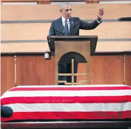  ??  ?? Former U.S. president Barack Obama speaks at the funeral for John Lewis at Ebenezer Baptist Church in Atlanta on Thursday.