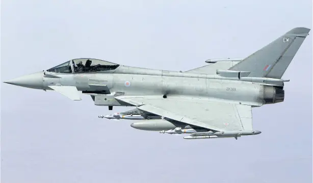  ?? REUTERS ?? A file photo shows a British Royal Air Force Eurofighte­r Typhoon cambat aircraft in flight during a mission over central Iraq.