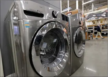  ?? (AP/Steven Senne) ?? Orders to U.S. factories for big-ticket manufactur­ed goods like this washer and dryer rose in February.
