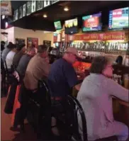  ?? KEVIN MARTIN — THE MORNING JOURNAL ?? Cavs fans arrive early at Scorcher’s Bar and Grill at 900 Broadway Ave. in Lorain to grab a seat at the bar for game four of the NBA Finals against the Golden State Warriors. Featuring more than 30 beers on tap, Scorcher’s is the premier sports bar in...