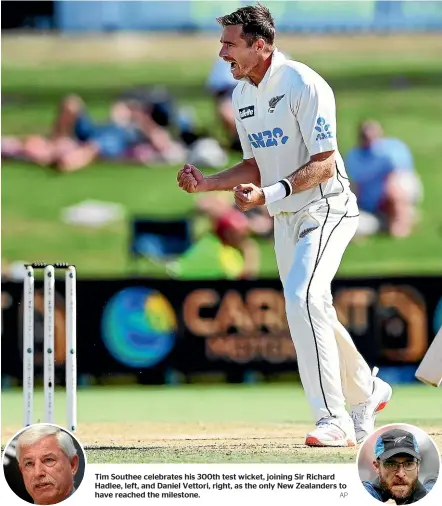  ?? AP ?? Tim Southee celebrates his 300th test wicket, joining Sir Richard Hadlee, left, and Daniel Vettori, right, as the only New Zealanders to have reached the milestone.