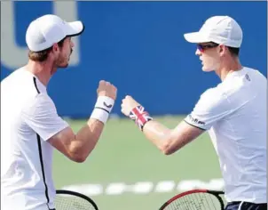  ?? GETTY IMAGES/AFP ?? Andy Murray (left) and his brother Jamie Murray of Great Britain celebrate a point during their doubles match against Nicolas Mahut and Edouard Roger-Vasselin of France at the Citi Open at Rock Creek Tennis Centre on Wednesday in Washington, DC.