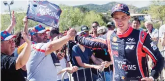  ??  ?? Thierry Neuville (BEL) celebrates the podium during the FIA World Rally Championsh­ip 2017 in Bastia, France on April 9, 2017