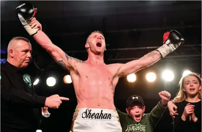  ?? RAMSEY CARDY / SPORTSFILE ?? Roy Sheahan celebrates with son Cameron and daughter Sasha as referee Emile Tiedt declares him the winner against Jack Cullen in their final bout in the Last Man Standing tournament at the National Stadium, where Ricky Hatton and Michael O’Reilly were among the crowd