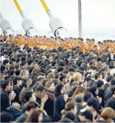  ?? — AFP ?? In honour of the late Thai King Bhumibol Adulyadej, 999 Buddhist monks lead prayers to commemorat­e his birthday on top of Bhumibol Bridge in Bangkok on Monday.