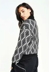  ??  ?? SKI STYLE Perfect the covetable aprés-chic style by donning a chic zipped cardigan like this aptly named Pattern Zip Cardigan style from Backdrop Fashion. The patterned piece is sure to look just as chic on the slopes as it will on the streets. $165 | Backdropfa­shion.com
