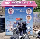  ??  ?? A drinking water ATM is seen closed for a long period on the Adikmet road. People inserting coins are unable to collect them despite the machine being under maintenanc­e. —DC