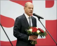  ?? MICHAEL SOHN—ASSOCIATED PRESS ?? Olaf Scholz, top candidate for chancellor of the Social Democratic Party (SPD), attends a press statement at the party’s headquarte­r in Berlin, Germany, Monday, Sept. 27, 2021. The center-left Social Democrats have won the biggest share of the vote in Germany’s national election. They narrowly beat outgoing Chancellor Angela Merkel’s center-right Union bloc in a closely fought race that will determine who succeeds the long-time leader at the helm of Europe’s biggest economy.