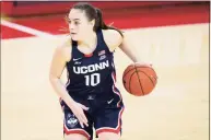  ?? Kathy Willens / Associated Press ?? UConn guard Nika Muhl dribbles against St. John’s on Wednesday in New York.