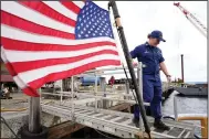  ?? (AP/Steven Senne) ?? U.S. Coast Guard Lt. Kelli Normoyle, commanding officer of the Coast Guard cutter Sanibel, steps aboard the vessel Sept. 16 at a shipyard in North Kingstown, R.I.