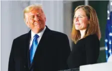  ?? AP FILE PHOTO/PATRICK SEMANSKY ?? President Donald Trump and Amy Coney Barrett stand on the Blue Room Balcony after Supreme Court Justice Clarence Thomas administer­ed the Constituti­onal Oath to her on the South Lawn of the White House White House in Washington.