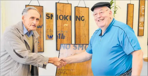  ?? PICTURE / PAUL BROOKS ?? The Men’s Shed’s John Wicks (left) presents the plaque to Fred Holmes.