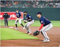  ?? (AP Photo/Tommy Gilligan, File) ?? Minnesota Twins first baseman Jose Miranda, second baseman Luis Arraez and shortstop Carlos Correa (4) stand in a defensive infield shift May 4, 2022, during the fourth inning of a baseball game against the Baltimore Orioles in Baltimore. Opening day will feature three of the biggest changes since 1969: Two infielders will be required to be on either side of second base, base size will increase to 18-inch squares from 15 and a pitch clock will be used.