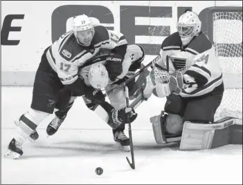  ?? The Associated Press ?? SLOW MOTION: St. Louis Blues left wing Jaden Schwartz (17) slows down Nashville Predators right wing Craig Smith (15) as Blues goalie Jake Allen (34) watches during the first period in Game 6 of a second-round NHL playoff series Sunday in Nashville,...