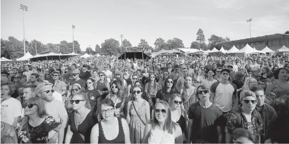  ??  ?? A throng of festival-goers watches indie-rock band Said the Whale during Rifflandia at Royal Athletic Park on Friday.