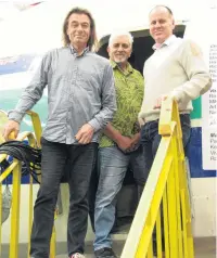  ?? PHOTO: MARK PRICE ?? Radio New Zealand National presenter Paul Brennan, social media organiser Darren Hunter and Wanaka Transport and Toy Museum owner Jason Rhodes, on the steps leading to the museum’s Fokker Friendship.