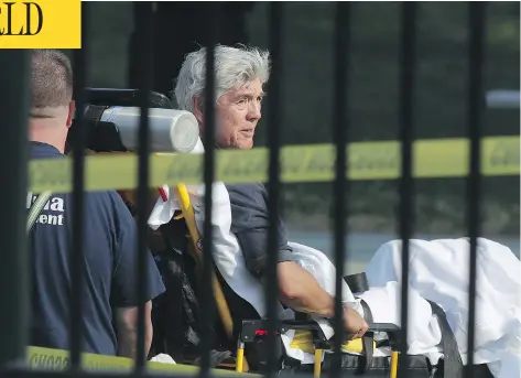  ?? ALEX WONG / GETTY IMAGES ?? U.S. Rep. Roger Williams was wheeled away by emergency medical service personnel from the Eugene Simpson Stadium Park following a shooting on Republican­s practicing for a charity baseball game Wednesday in Alexandria, Virginia. Five were wounded and...
