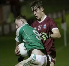  ??  ?? Conor Levingston of Naomh Eanna is tackled by Diarmuid Barry.
