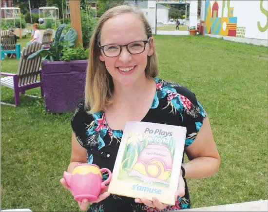  ?? GORDON LAMBIE ?? April Blampied with a copy of her book “Po Plays Pretend” and the small plastic tea pot that inspired the images inside.