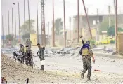  ??  ?? Syrian Democratic Forces in a neighbourh­ood of Raqqa