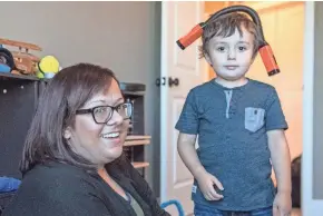  ?? MILWAUKEE JOURNAL SENTINEL ?? Eli Wade, 4, plays in his room with his mom, Jessica Wade.