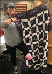  ?? PHOTO COURTESY OF CAROLE CARROLL ?? A patient receives a quilt donated by Miracle Quilts for our Wounded Troops last year.