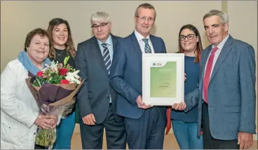  ?? ?? IFA stalwart Michael Ryan, Mitchelsto­wn (right) is pictured receiving an Honorary Life Membership Award from Tim Cullinan, IFA President while Cork North IFA Chairman Pat O’Keeffe presents a bouquet to Alice Ryan. Also included are their daughters Margaret and Catriona Ryan.