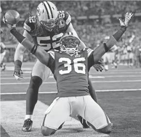  ?? PAUL SANCYA / AP ?? Former Packers safety Nick Collins celebrates a touchdown with linebacker Clay Matthews during Super Bowl XLV against the Steelers.