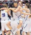  ?? MARLA BROSE/JOURNAL ?? Elida players celebrate after they beat Melrose to win the Class 1A state championsh­ip Friday in the Pit.