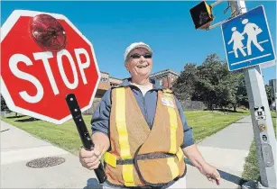  ?? CLIFFORD SKARSTEDT EXAMINER FILE PHOTO ?? Crossing guard Dianne White at Queen Mary Public School on Monaghan Rd.