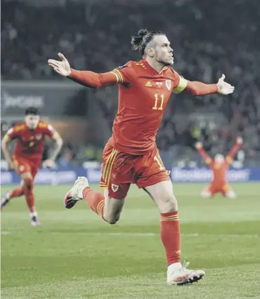  ?? ?? Gareth Bale celebrates after scoring his and Wales’ second goal at Cardiff City Stadium last night