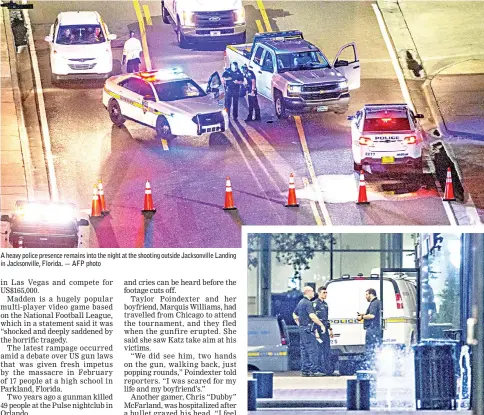  ?? — AFP photo ?? A heavy police presence remains into the night at the shooting outside Jacksonvil­le Landing in Jacksonvil­le, Florida.