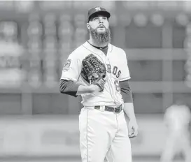  ?? Gary Coronado / Houston Chronicle ?? Astros starter Dallas Keuchel shakes off a home run by the Mariners’ Mark Trumbo, the first homer Keuchel has given up at home in more than a year.