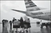  ?? RICH SUGG/KANSAS CITY STAR ?? A U.S. Navy Reserve Honor Guard carry the remains of Seaman First Class Wilbur F. Newton, who was killed Dec. 7, 1941, while stationed on the USS Oklahoma in Pearl Harbor, as they are returned to his hometown of Mound City, Mo.