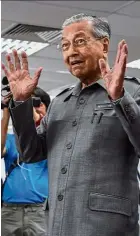  ??  ?? In fashion: Dr Mahathir’s retro accessorie­s of Pilot Ball Liners and name tags are making a comeback. Err, Bush jackets, anyone?