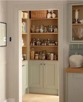  ??  ?? THIS PAGE Stylish well-designed storage solutions feature in Howdens kitchens, including integrated shelving, pull-out units and plate racks, and internal cutlery drawers. Customise your design with accessorie­s such as drawer and cupboard handles and...