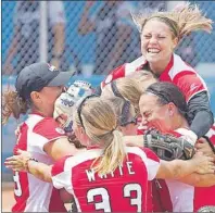  ?? CP PHOTO ?? Teammates mob Canadian pitcher Sara Groenewege­n after recording the last out to beat the United States in extra innings to win the gold medal in women’s softball at the Pan American Games in Ajax, Ont., Sunday.