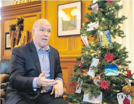  ??  ?? B.C. Premier John Horgan in his office at the B.C. legislatur­e: “One of the objectives of this undertakin­g is to get the gang lifestyle out of the cannabis market and make it a mainstream controlled substance like tequila or scotch or beer.”