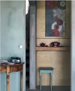  ??  ?? CLOCKWISE FROM FAR LEFT: Jeanine and Philipp Oxenius look out over Long Bay Regional Park and the beach. Steadfast Constructi­on made the front steps which Jeanine painted to look like concrete. A curved glass extraction fan/ light is a focal point of the kitchen. A vintage telephone sits beneath a floral artwork that is typical of those Jeanine creates for Byebyelove. A double-height atrium floods the stairwell with natural light and pendants from Ikea illuminate it at night. Temptation from Jeanine’s Creation series hangs alongside a giant earthenwar­e screwdrive­r by Richard Darbyshire.