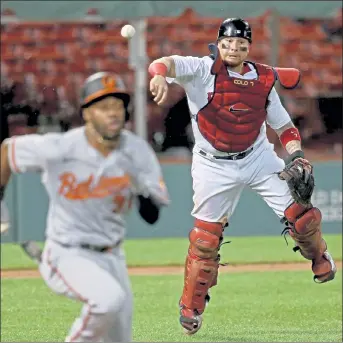  ?? MATT STONE / BOSTON HERALD FILE ?? Red Sox catcher Christian Vazquez throws to first during a game against the Orioles on Thursday. Red Sox president Sam Kennedy and chief baseball officer Chaim Bloom have said that getting the team back to a competitiv­e level is their top priority.